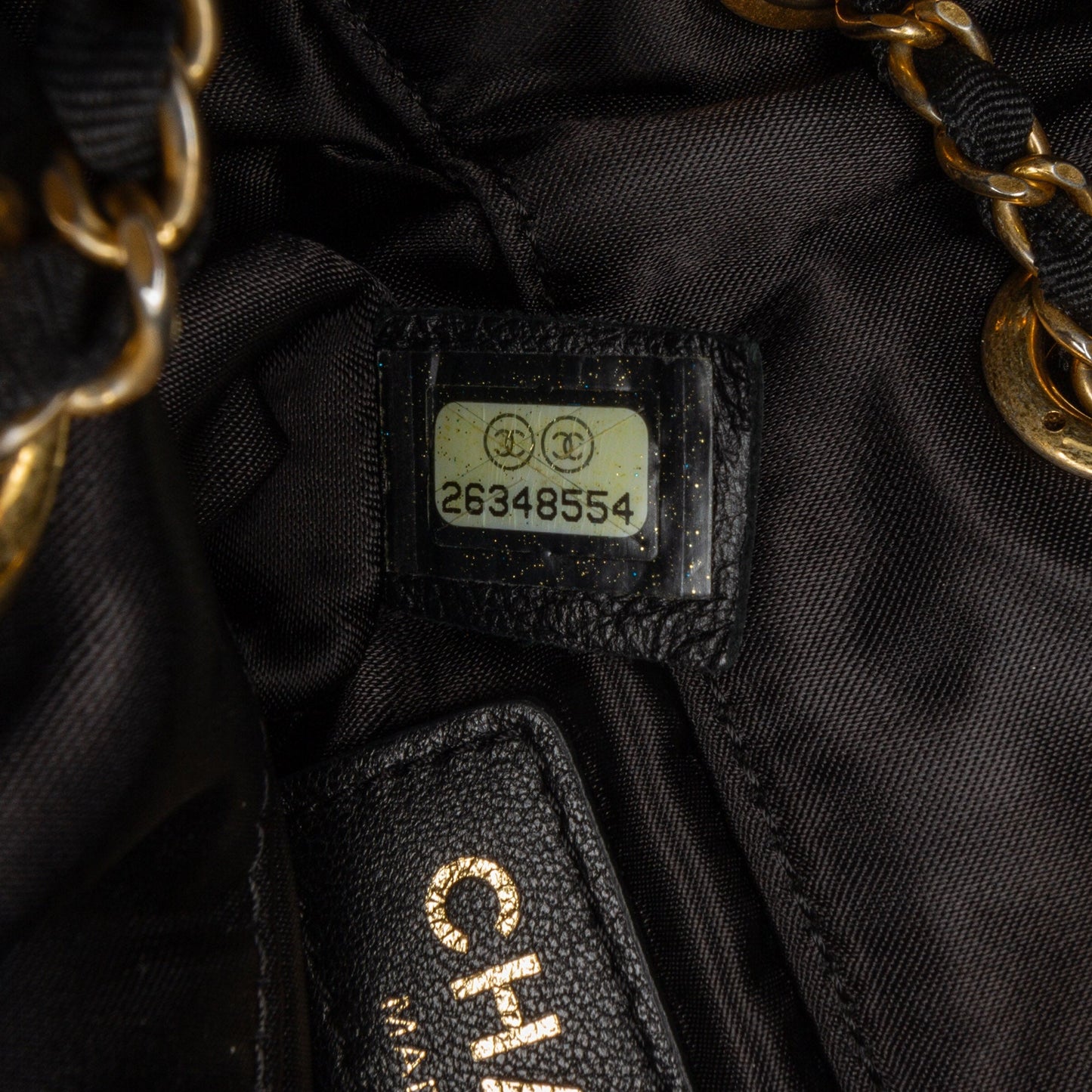 Chanel Quilted Nylon Crystal CC Drawstring Sling Bag Black